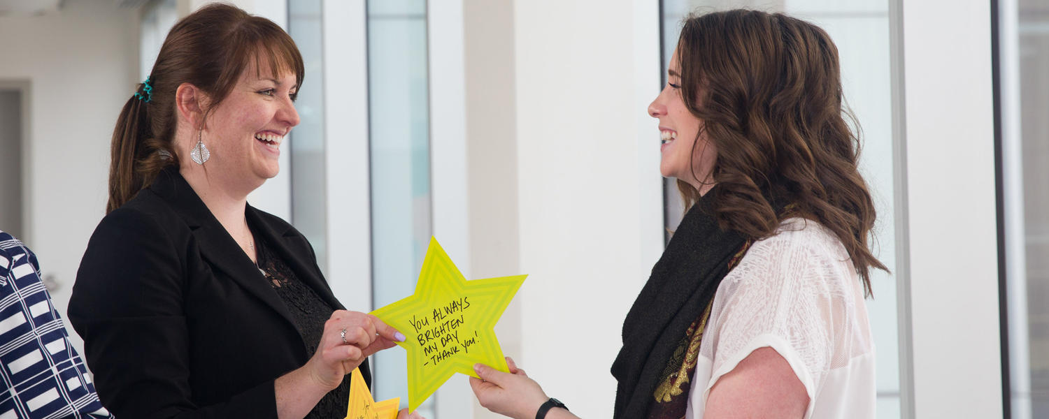 colleagues recognizing one another with United Way stars