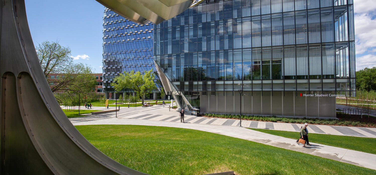 A glass building on a lawn