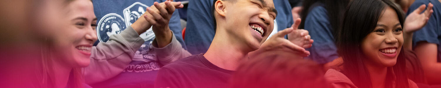 Students laughing together in a crowd