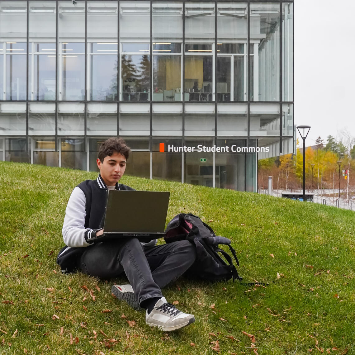 student using a laptop outside