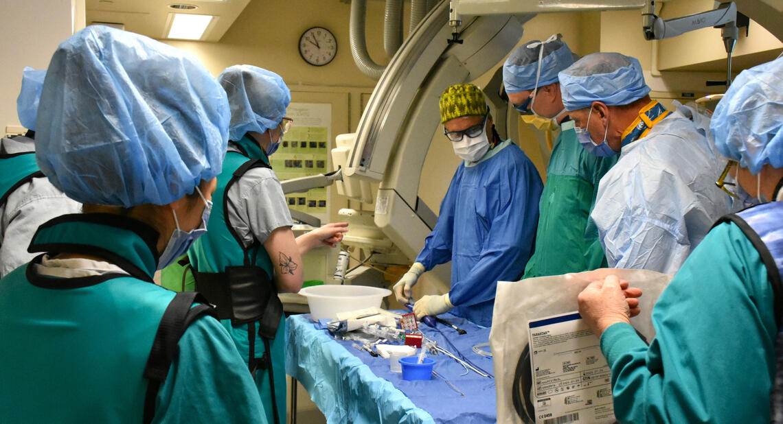 A group of surgeons performing an operation