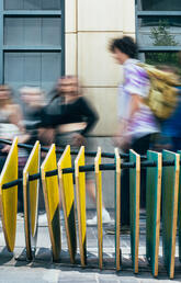 The public walking past the "Strata" Bench.