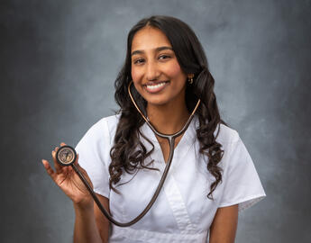 woman in nursing scrubs with a stethascope