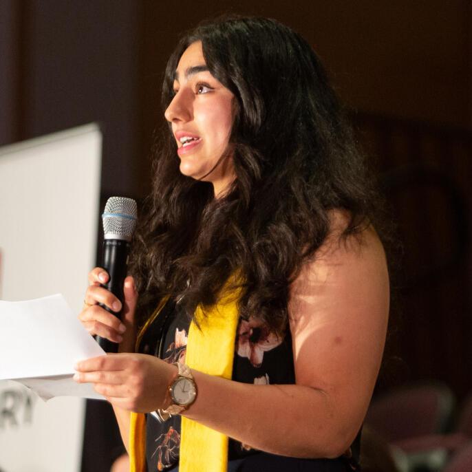 A woman holding a microphone