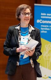 A woman gives a presentation