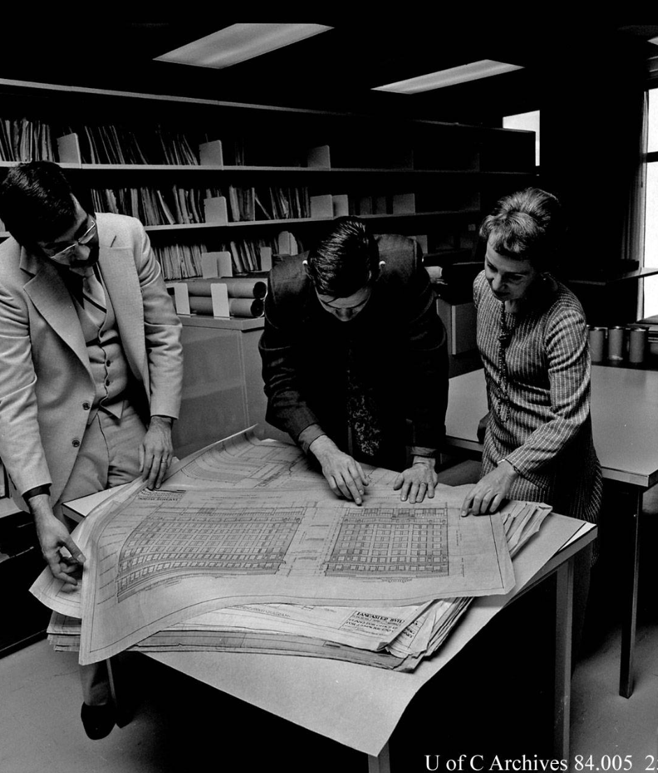 Canadian Architectural Archives Image of (L to r) Ernie Ingles, librarian; Dr. Michael McMordie, EVDS; Annalise K. Walker, curator, Canadian Architectural Archives; examining documents, October 1977.